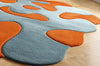 Handmade Wool Tufted Rug: Burnt Orange & Soft Blue, Modern Floral Design
