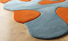 Handmade Wool Tufted Rug: Burnt Orange & Soft Blue, Modern Floral Design