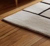 Handmade Geometric Tufted Wool Rug: Black and White Abstract Design (6x9 ft